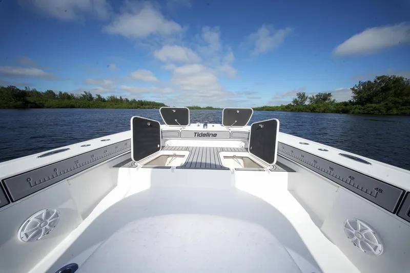  Yacht Photos Pics 2020 Tideline 365 Offshore boat on calm water under blue sky.