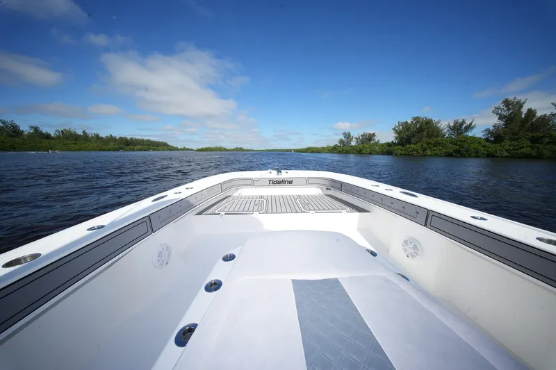  Yacht Photos Pics 2020 Tideline 365 Offshore boat on calm water under blue sky.