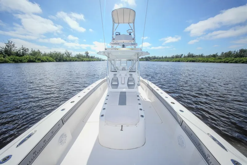  Yacht Photos Pics 2020 Tideline 365 Offshore boat on calm water under a clear blue sky.