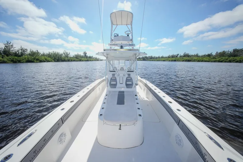  Yacht Photos Pics 2020 Tideline 365 Offshore boat on calm water under a clear blue sky.