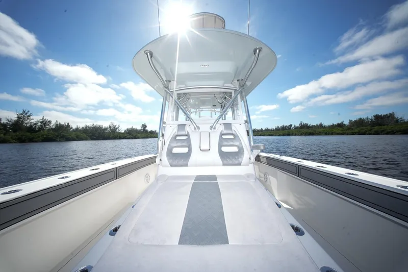  Yacht Photos Pics 2020 Tideline 365 Offshore boat on a sunny day, with clear blue skies and calm waters.