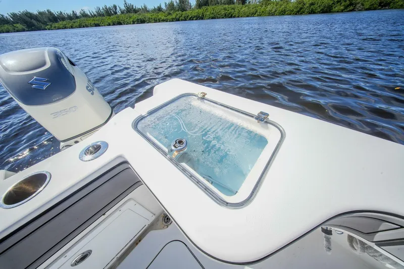  Yacht Photos Pics 2020 Tideline 365 Offshore boat with Suzuki engine on a serene waterway.