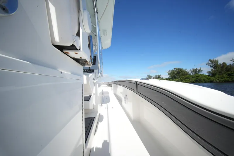  Yacht Photos Pics 2020 Tideline 365 Offshore boat deck with clear blue sky and lush greenery.