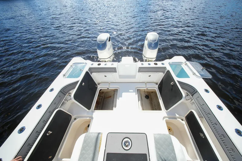  Yacht Photos Pics 2020 Tideline 365 Offshore boat deck with dual engines on open water.