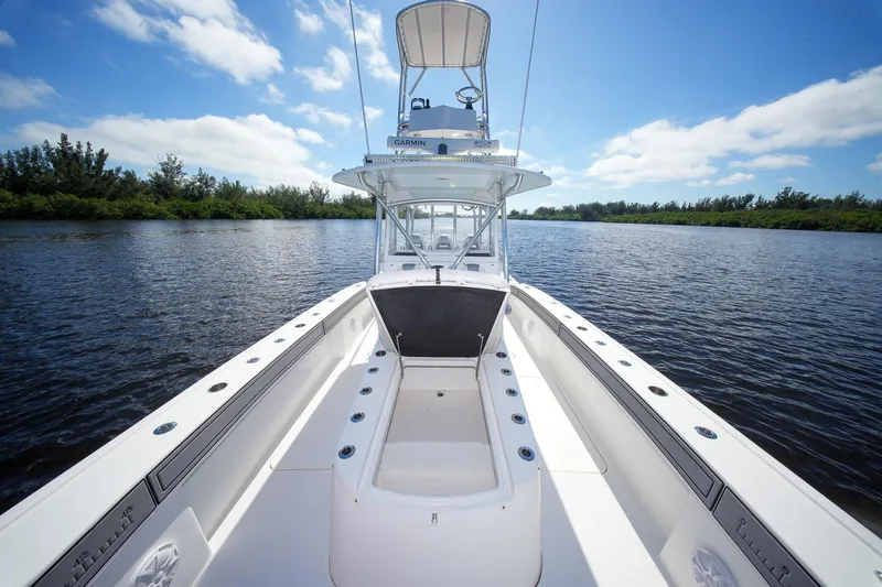  Yacht Photos Pics 2020 Tideline 365 Offshore boat on calm water under a clear blue sky.