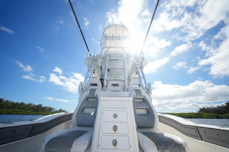  Yacht Photos Pics 2020 Tideline 365 Offshore boat under bright blue sky and sunlight.