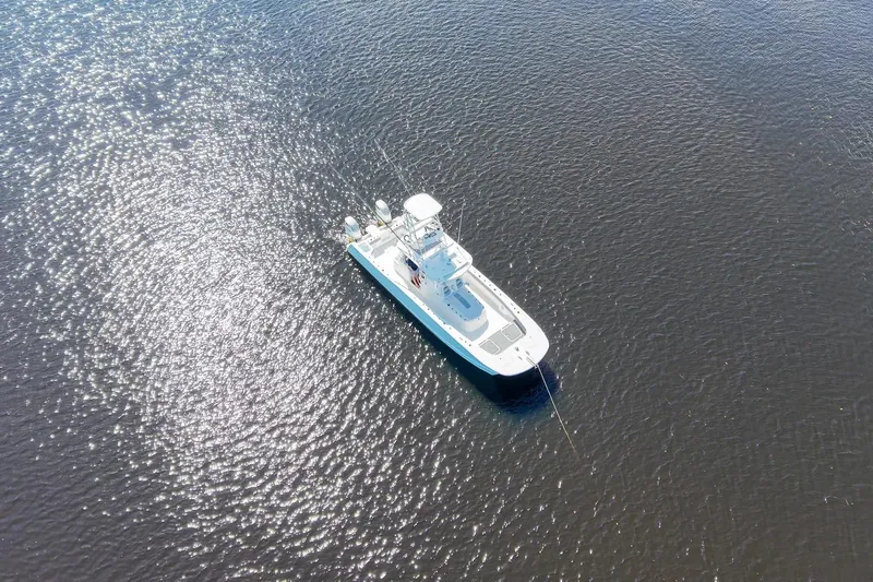  Yacht Photos Pics Aerial view of 2020 Tideline 365 Offshore boat on shimmering water.