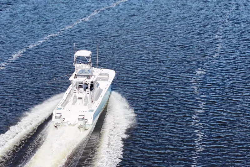  Yacht Photos Pics 2020 Tideline 365 Offshore boat cruising on open water, leaving a wake.