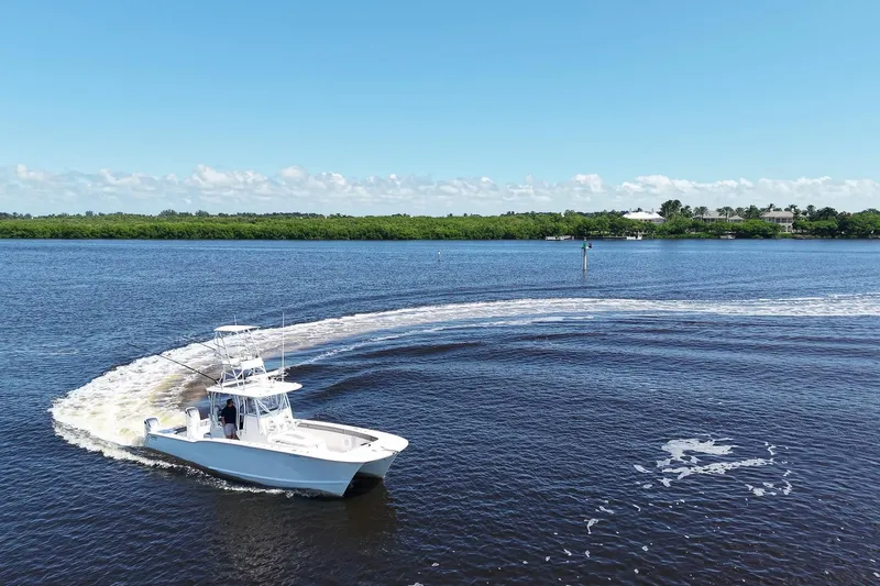  Yacht Photos Pics 2020 Tideline 365 Offshore boat making a turn on a sunny day.