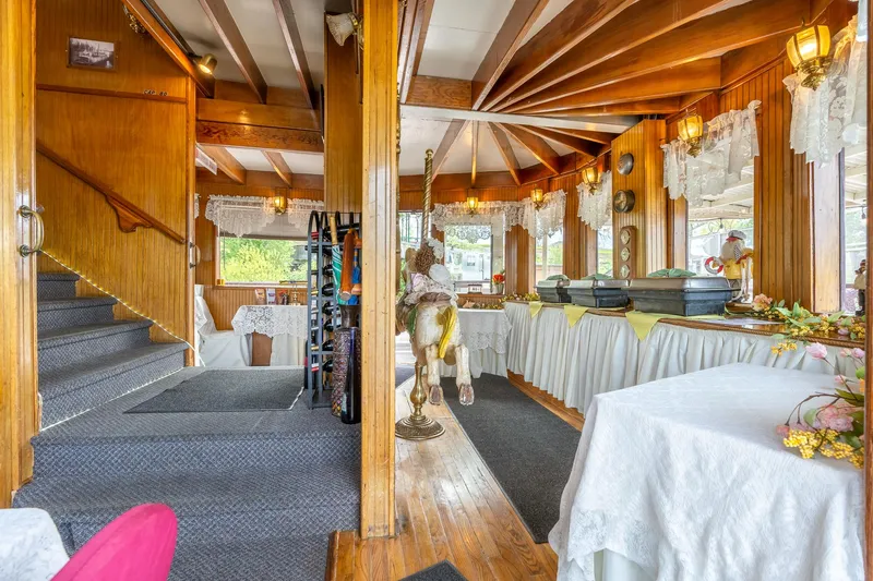 Willamette Queen Yacht Photos Pics Interior of 1990 Custom Howdy Eidelman Sternwheeler, featuring elegant decor and buffet setup.