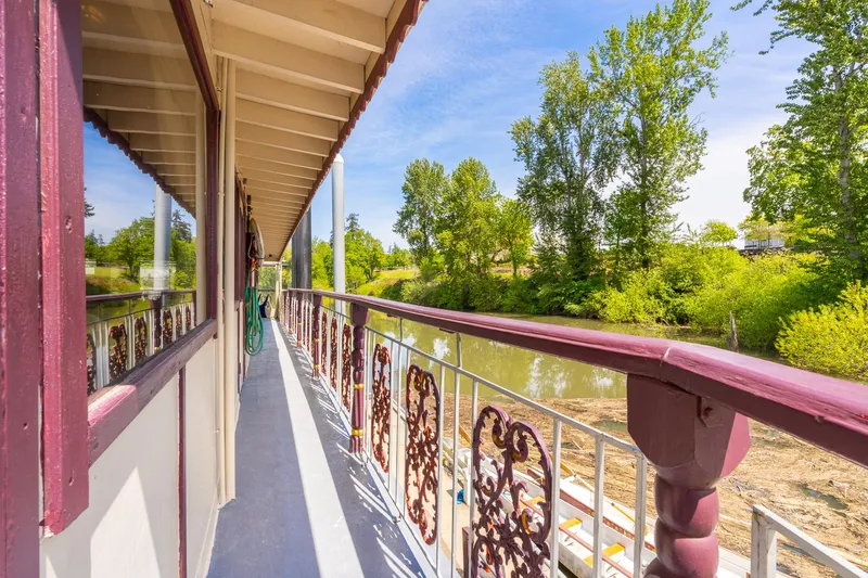 Willamette Queen Yacht Photos Pics Side view of 1990 Custom Howdy Eidelman Sternwheeler, Jack Sarin model, on a scenic river.