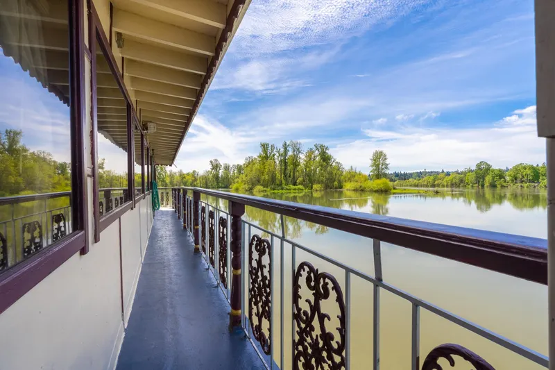 Willamette Queen Yacht Photos Pics Side view of 1990 Custom Howdy Eidelman Sternwheeler on a serene river.