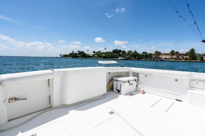 Fancy Yacht Photos Pics Cabo 45 Express 2000 yacht deck with ocean view and clear blue sky.