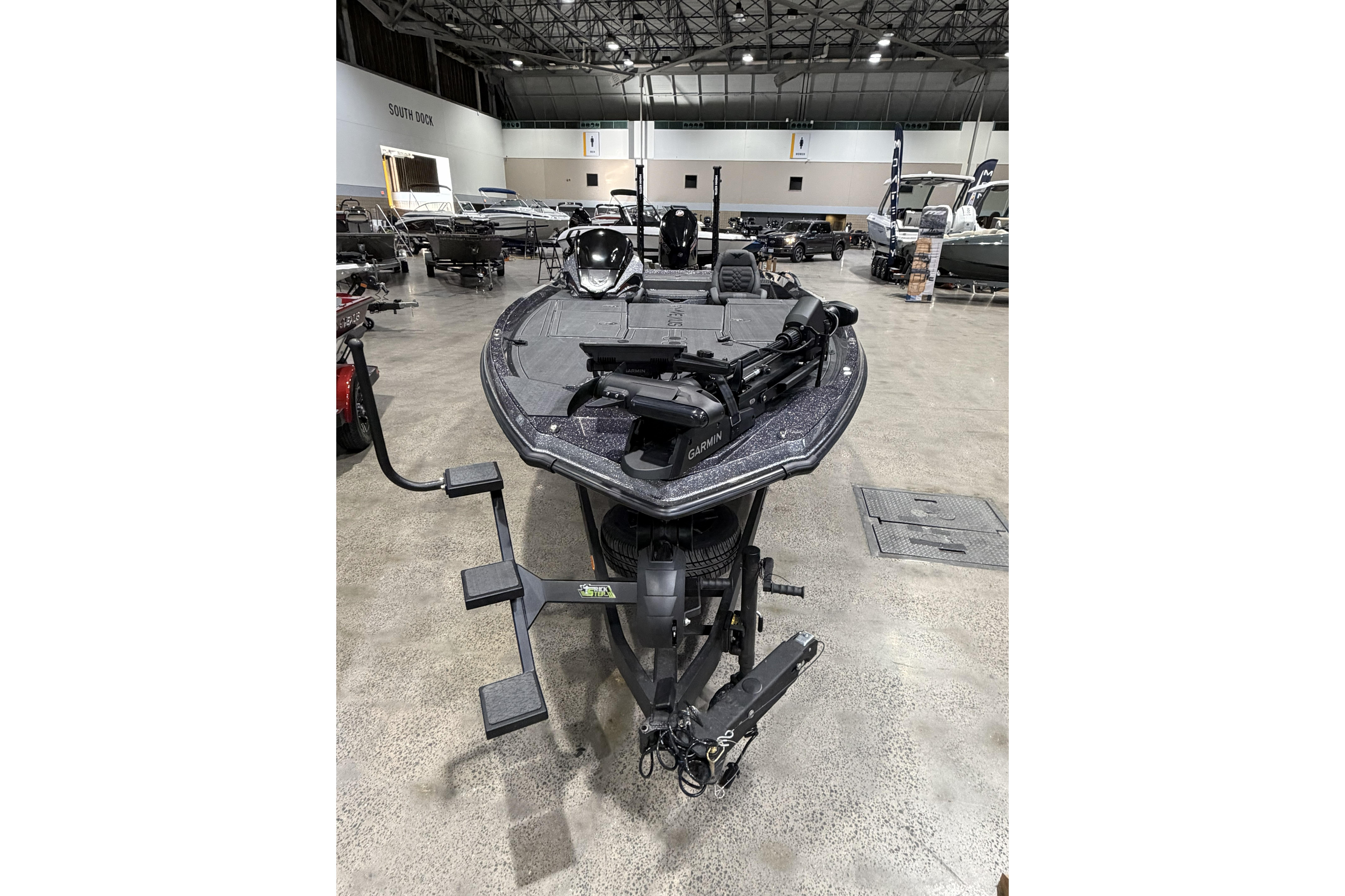 2026 Vexus boat displayed in a showroom with advanced equipment.