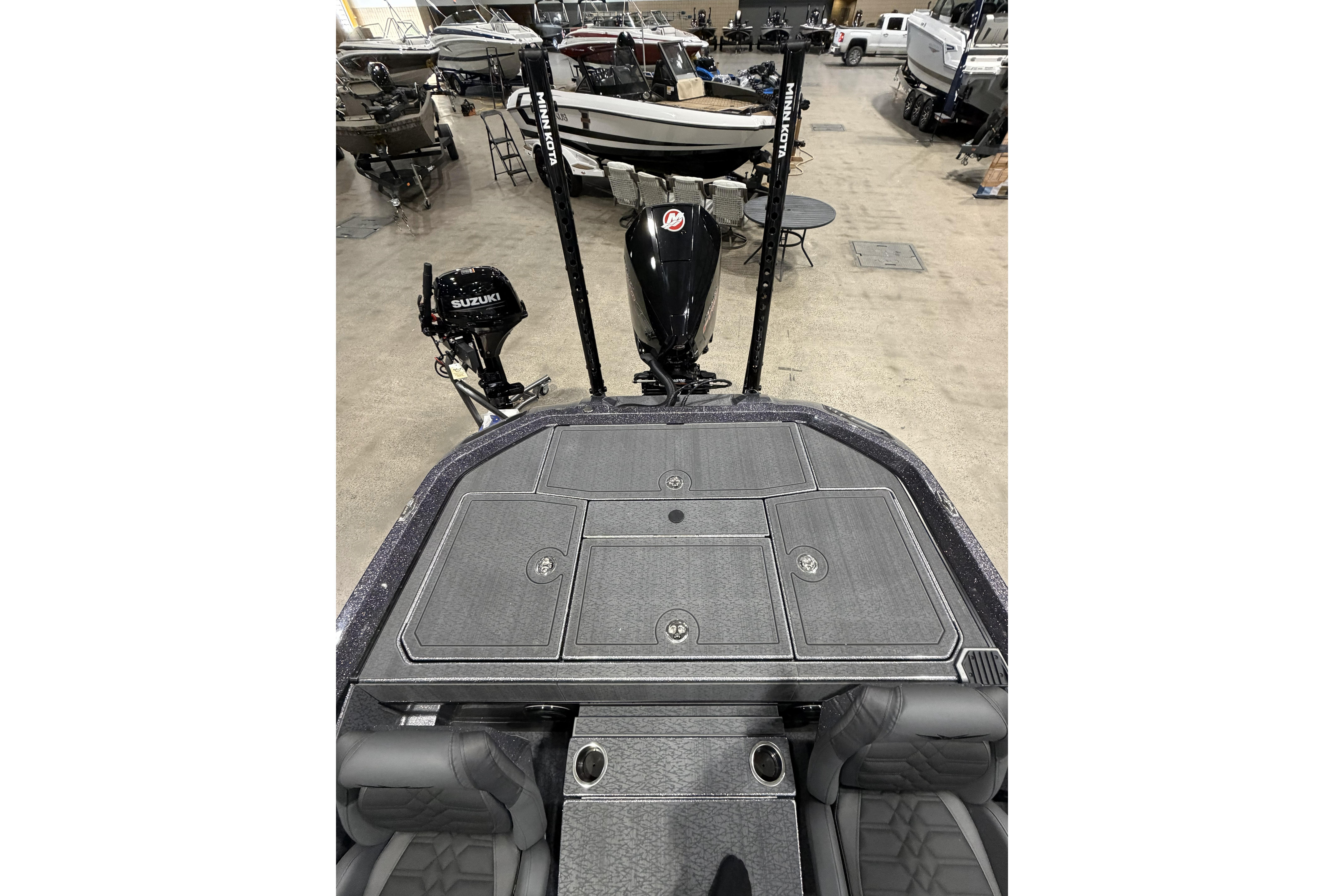 2026 Vexus boat interior with Suzuki motor, featuring storage compartments and seating.