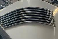Close-up of 2001 Nimbus 345 Coupe boat's sleek chrome railings.