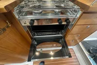 Stainless steel oven in 2001 Nimbus 345 Coupe boat kitchen, with wooden cabinetry.