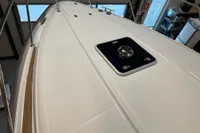 Nimbus 345 Coupe 2001 boat deck with hatch, featuring sleek design and wood accents.