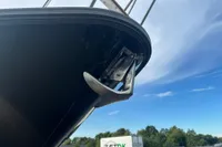 Bow of 2001 Nimbus 345 Coupe boat with anchor against blue sky.