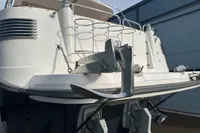 Rear view of a 2001 Nimbus 345 Coupe boat with anchor and railing.