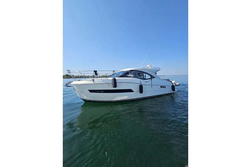  Yacht Photos Pics 2017 Carver C37 yacht on calm water under clear blue sky.