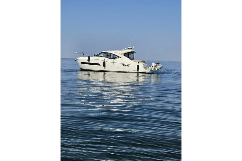  Yacht Photos Pics 2017 Carver C37 yacht on calm blue water under clear sky.