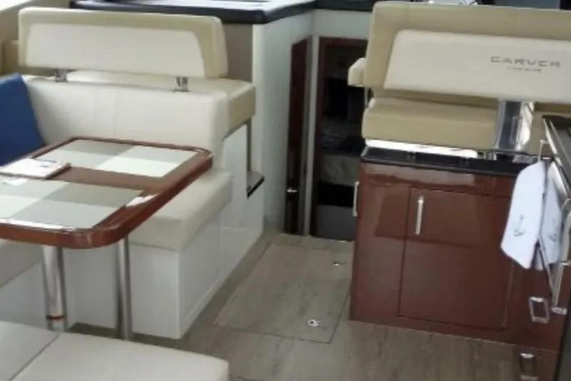  Yacht Photos Pics Interior of a 2017 Carver C37 yacht with seating and dining area.