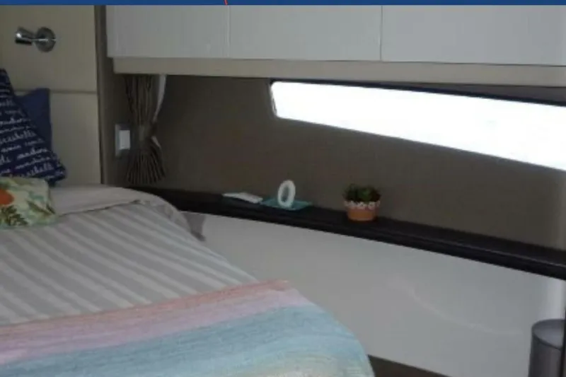  Yacht Photos Pics Cozy interior of 2017 Carver C37 yacht with bed and decorative elements.