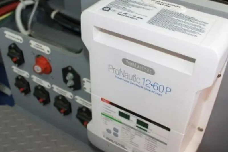  Yacht Photos Pics Electrical panel with ProNautic 12-60P charger in a 2017 Carver C37 boat.