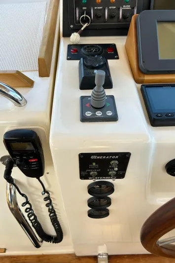 Bravo Yacht Photos Pics Control panel of 2005 Sabre 42 Hardtop Express yacht with joystick and communication device.