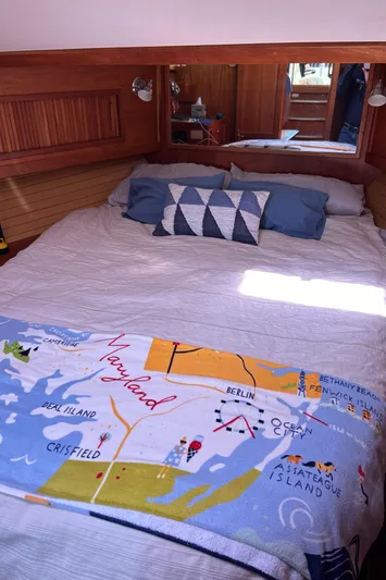 Bravo Yacht Photos Pics Cozy bedroom in 2005 Sabre 42 Hardtop Express yacht with nautical decor.