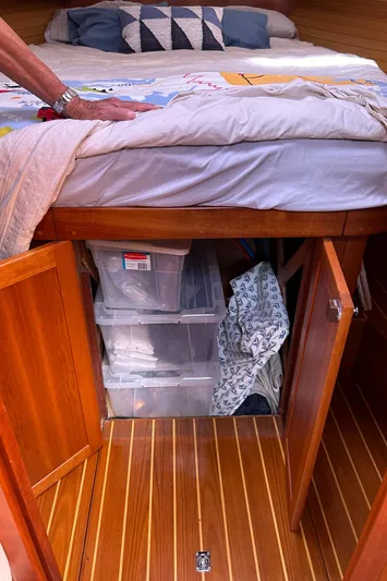 Bravo Yacht Photos Pics Storage area under bed in 2005 Sabre 42 Hardtop Express yacht.