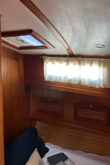 Bravo Yacht Photos Pics Interior cabin of 2005 Sabre 42 Hardtop Express with wooden finish and window.