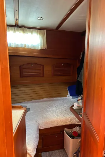 Bravo Yacht Photos Pics Cozy cabin interior of 2005 Sabre 42 Hardtop Express yacht with wooden accents.