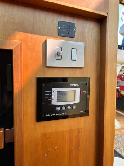 Bravo Yacht Photos Pics Control panel and switches on 2005 Sabre 42 Hardtop Express yacht interior.