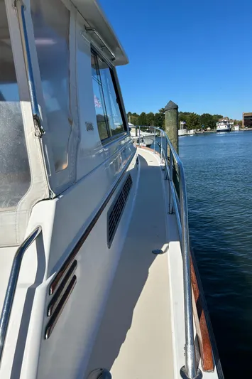 Bravo Yacht Photos Pics 2005 Sabre 42 Hardtop Express yacht docked by the water.