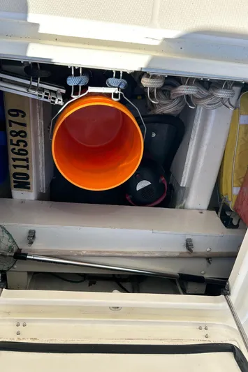 Bravo Yacht Photos Pics Engine compartment of 2005 Sabre 42 Hardtop Express with orange bucket and equipment.
