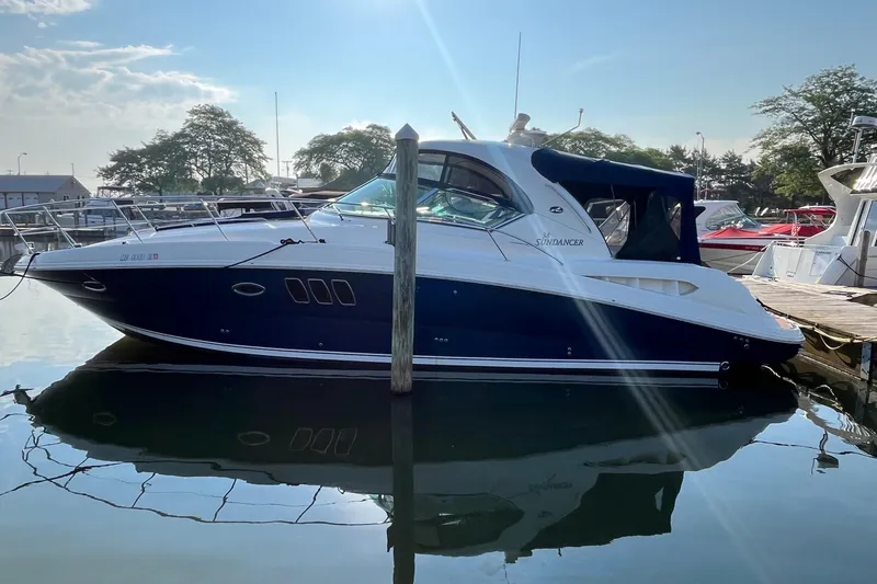 Sonship Yacht Photos Pics 2006 Sea Ray 380 Sundancer yacht docked in a marina under clear skies.