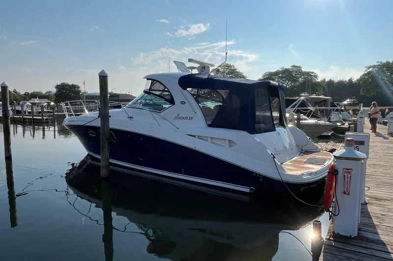 Sonship Yacht Photos Pics 2006 Sea Ray 380 Sundancer docked at a marina under a clear blue sky.