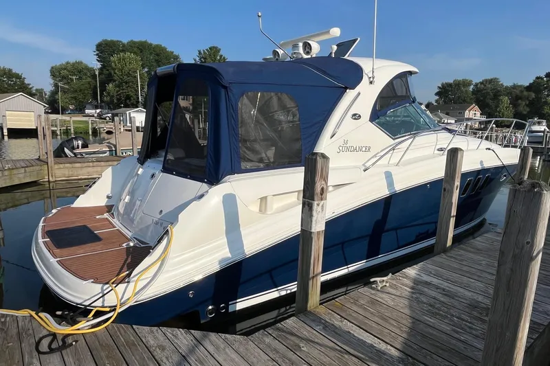 Sonship Yacht Photos Pics 2006 Sea Ray 380 Sundancer docked at a marina, featuring a sleek blue and white design.