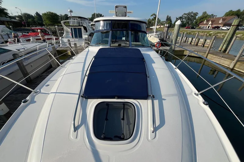 Sonship Yacht Photos Pics 2006 Sea Ray 380 Sundancer yacht docked at marina, featuring sleek design and spacious deck.