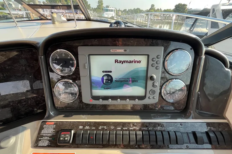 Sonship Yacht Photos Pics Dashboard of 2006 Sea Ray 380 Sundancer with Raymarine navigation display and gauges.