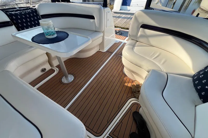 Sonship Yacht Photos Pics Interior of 2006 Sea Ray 380 Sundancer with white seating and wooden flooring.