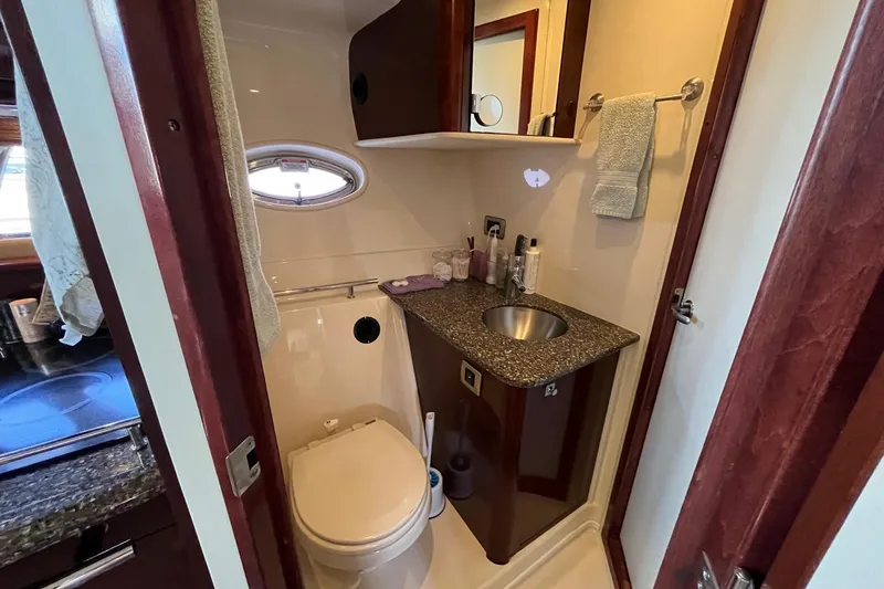 Sonship Yacht Photos Pics Luxurious bathroom in 2006 Sea Ray 380 Sundancer yacht with modern amenities.