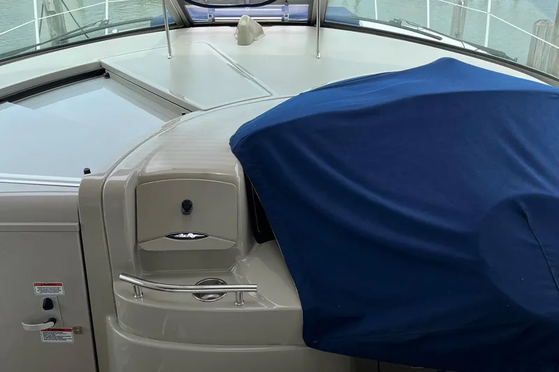 Sonship Yacht Photos Pics 2006 Sea Ray 380 Sundancer boat interior with blue cover and control panel.