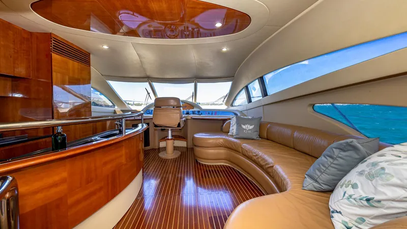  Yacht Photos Pics Luxurious interior of a 2007 Azimut 62 Flybridge yacht with elegant seating and panoramic windows.