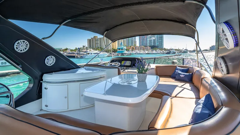  Yacht Photos Pics Luxurious 2007 Azimut 62 Flybridge yacht interior with elegant seating and waterfront view.