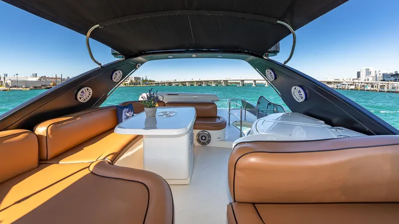  Yacht Photos Pics Luxurious 2007 Azimut 62 Flybridge yacht interior with leather seating and ocean view.