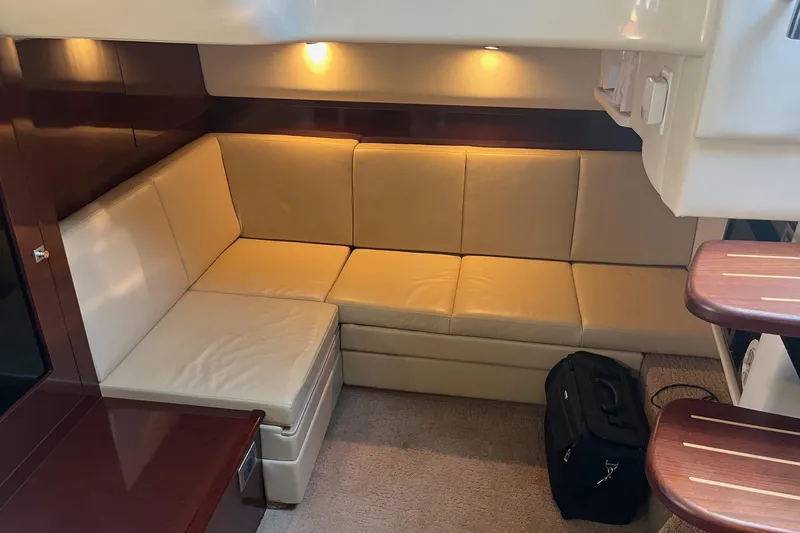 Sonship Yacht Photos Pics Interior of 2008 Sea Ray 38 Sundancer with beige leather seating and warm lighting.