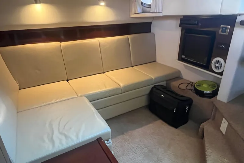 Sonship Yacht Photos Pics Interior of 2008 Sea Ray 38 Sundancer with beige seating and entertainment area.